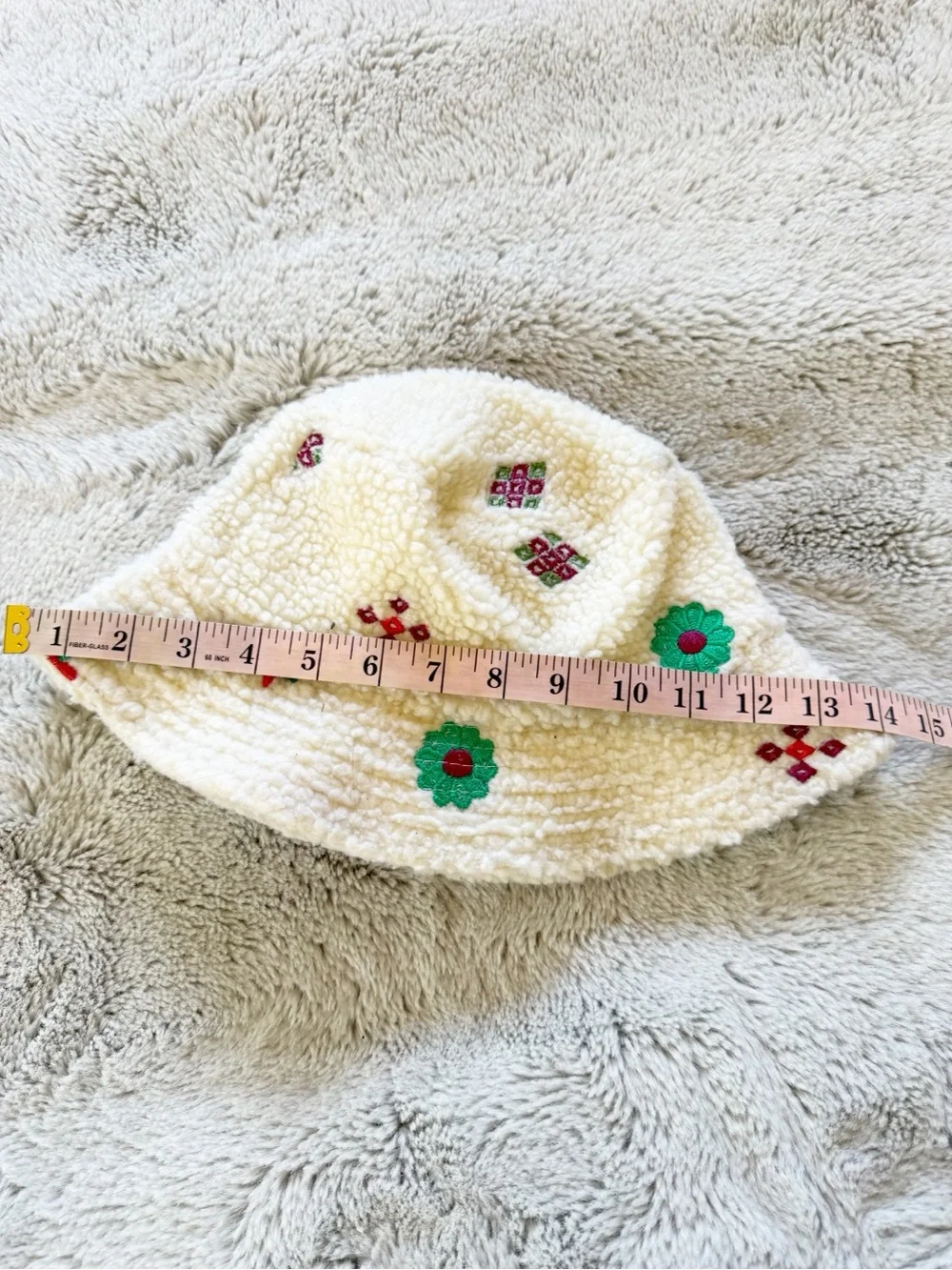 Urban Outfitters Cream Sherpa Bucket Hat with Green & Red Embroidery